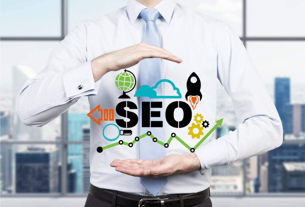 Businessman suggested effective 'SEO' optimisation approach. Hands presenting a 'SEO' flowchart
