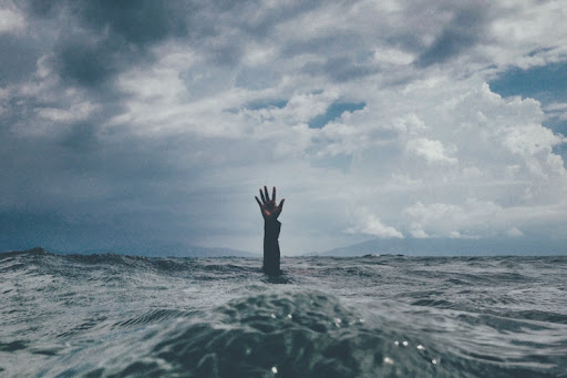 a hand out of the ocean